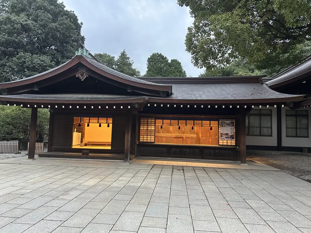 A shrine hall glowing at dusk