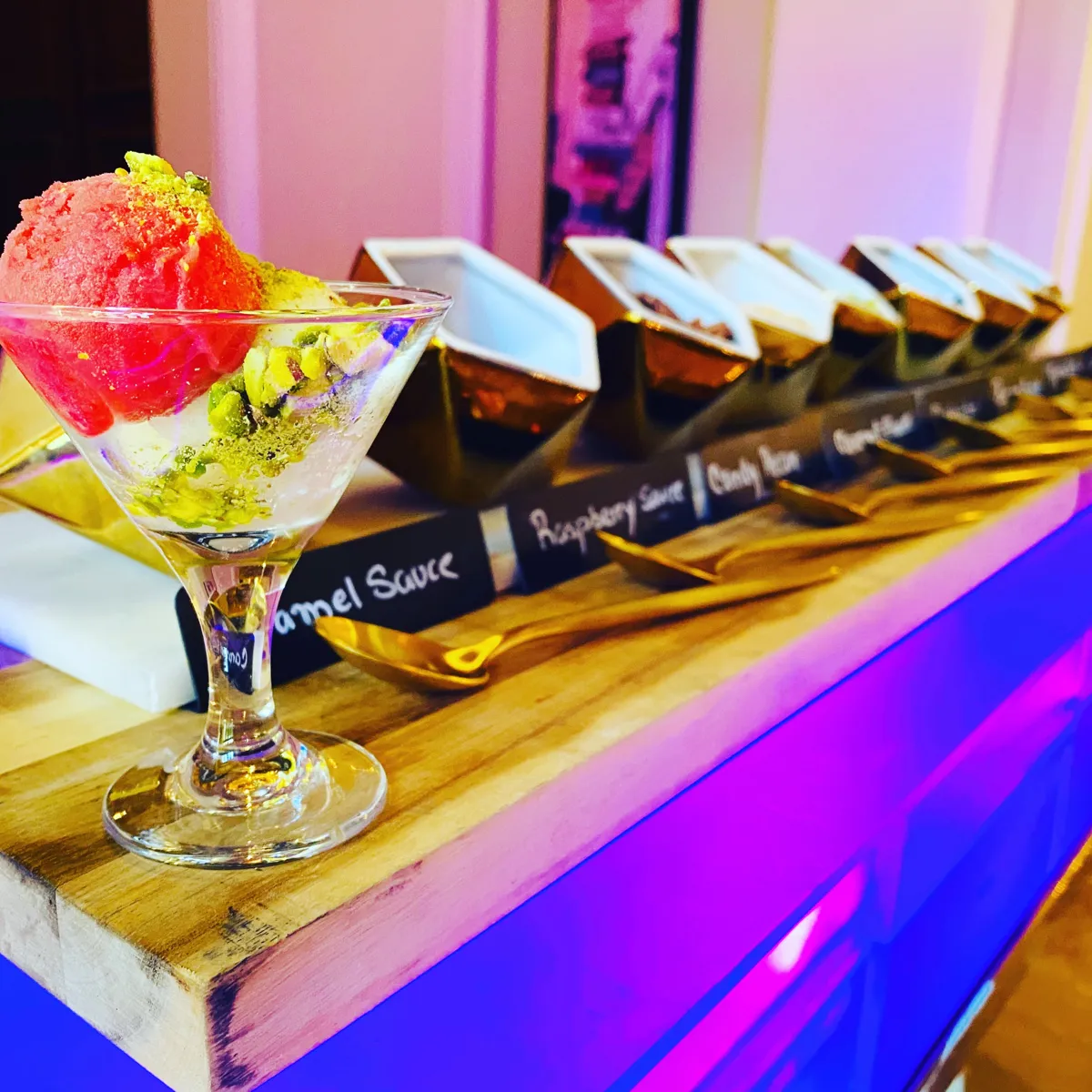 Ice cream cup with pistachio and a toppings bar