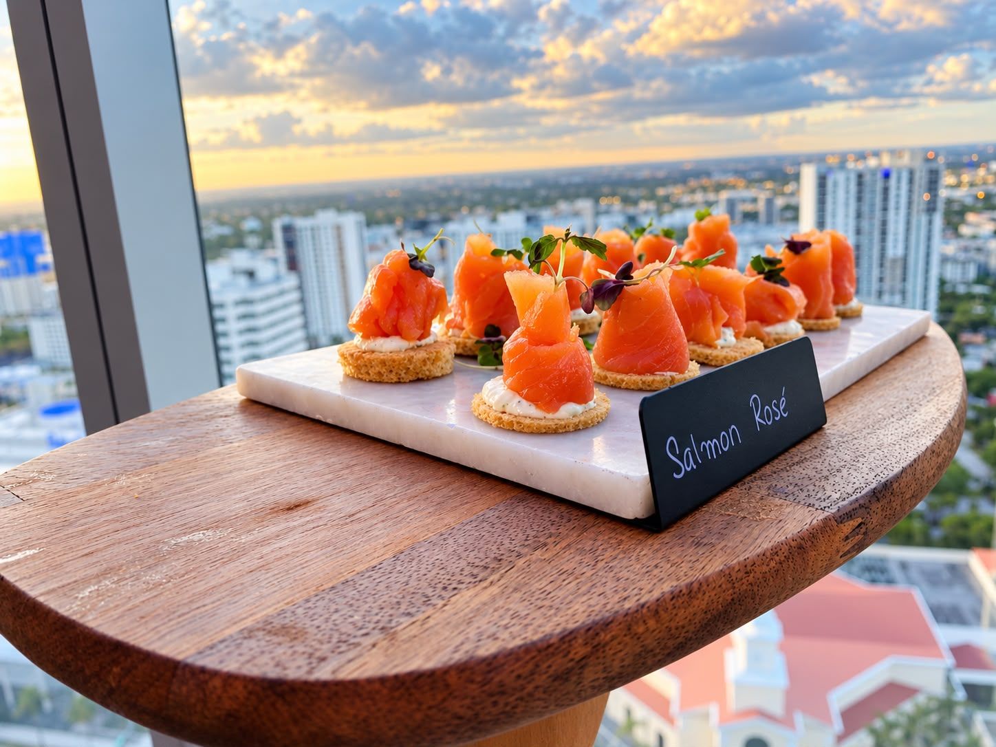 Salmon Rosé canapés with a skyline view