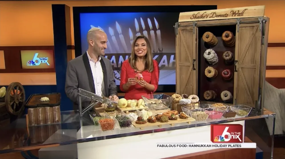 Chef Shaike and the host at the Shaike's Donuts Wall on NBC 6 In the Mix, Fabulous Food: Hannukkah Holiday Plates