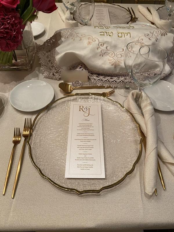 Shabbat table setting with embroidered challah cover