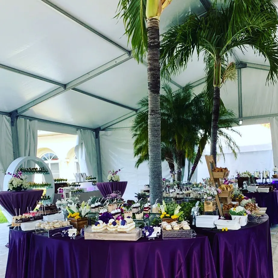 Large buffet and display setup under a tent